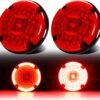 Main product image showing 2 round LED tail lights, perfect for transit buses, RVs, and campers, with red lens and surface mount gasket.
