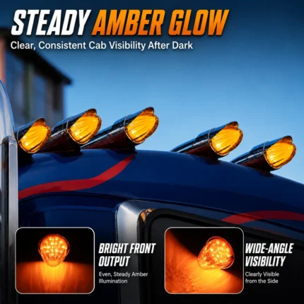Five amber torpedo-style marker lights installed and illuminated along the front edge of a truck cab roof