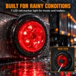 YFD Lighting red 7-LED round marker light glowing in rainy conditions with water droplets, wet surface reflections and rear-view details showing black and white wiring.